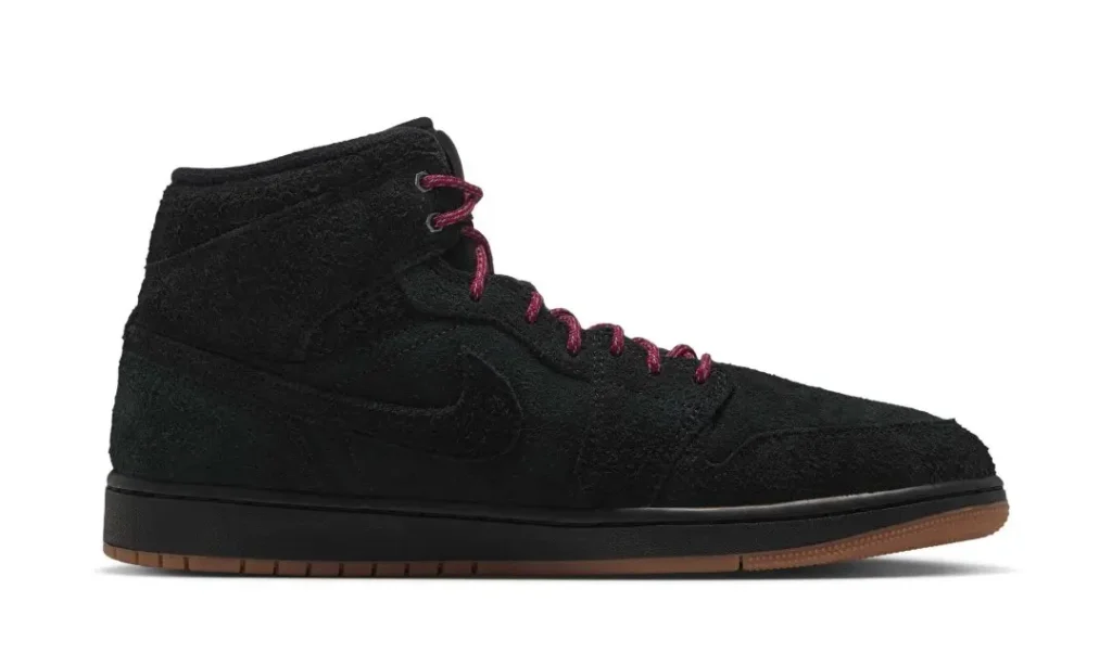 Black high-top shoe with burgundy laces and a brown rubber sole, shown in side profile on white background