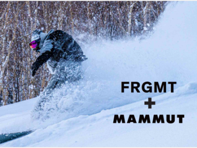 Snowboarder in black outerwear launches through powder beside text reading “FRGMT + MAMMUT”