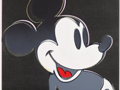 Stylized close-up of Mickey Mouse smiling, with black ears, white face, red tongue, and blue-gray clothing on a black