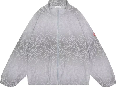 Gray zip-front jacket with an all-over pixelated pattern, stand collar, long sleeves, and red sleeve patch on white