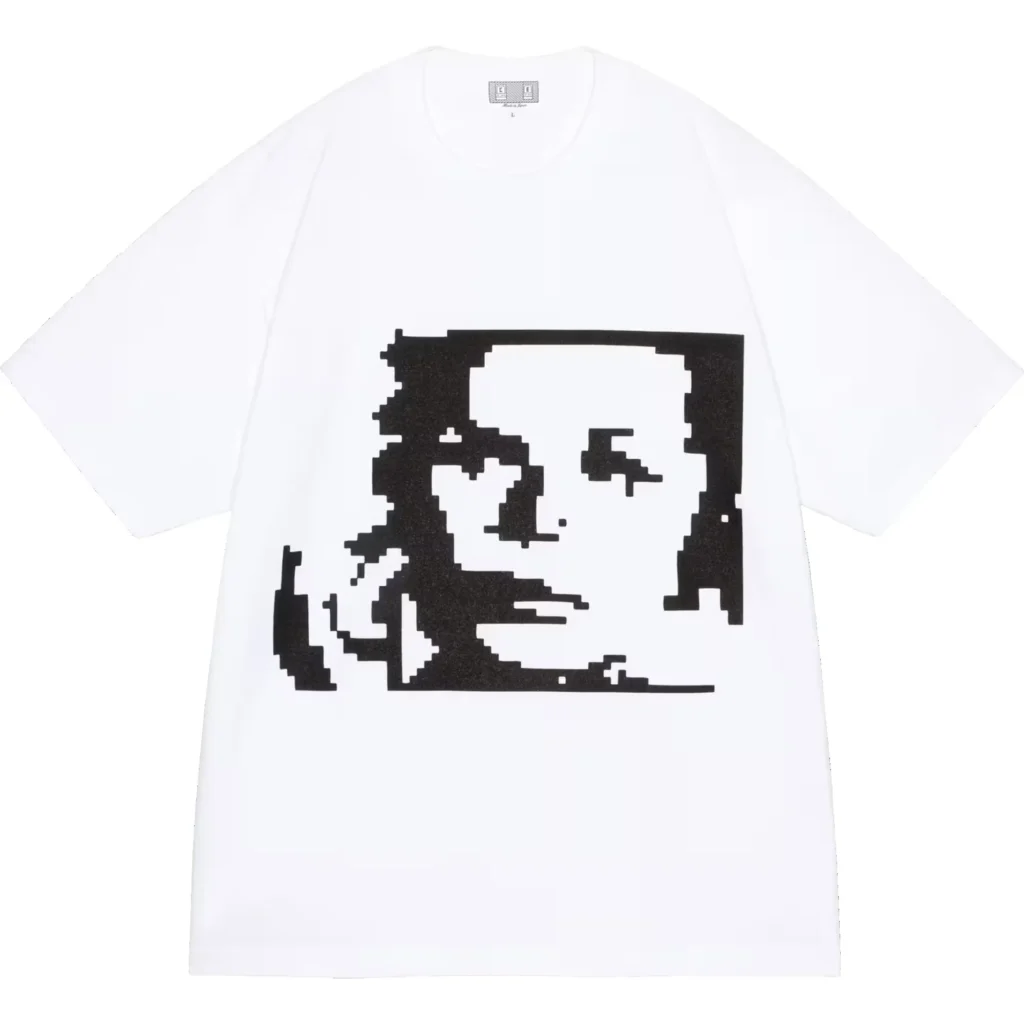 White T-shirt featuring a large black pixelated portrait graphic, displayed flat against a white background