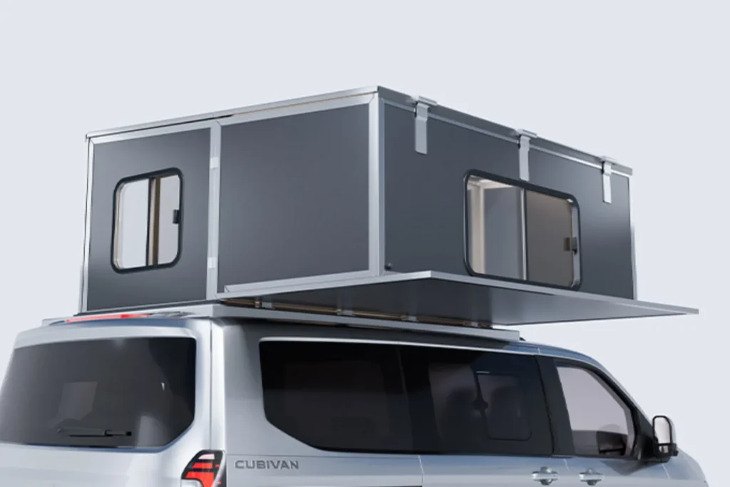 White Cubivan camper van with a dark gray rooftop room unfolded above it, featuring windows and an overhanging platform