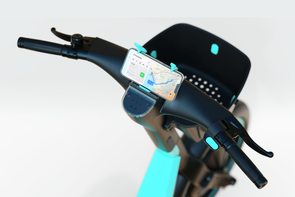 Close-up of a black electric trike with turquoise accents, handlebars, mounted smartphone showing a navigation map, and rear