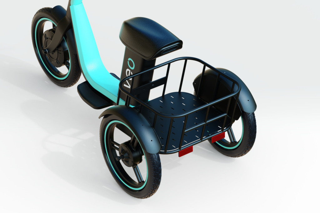 Black-and-turquoise electric trike with a padded seat and large wire cargo basket on a white background