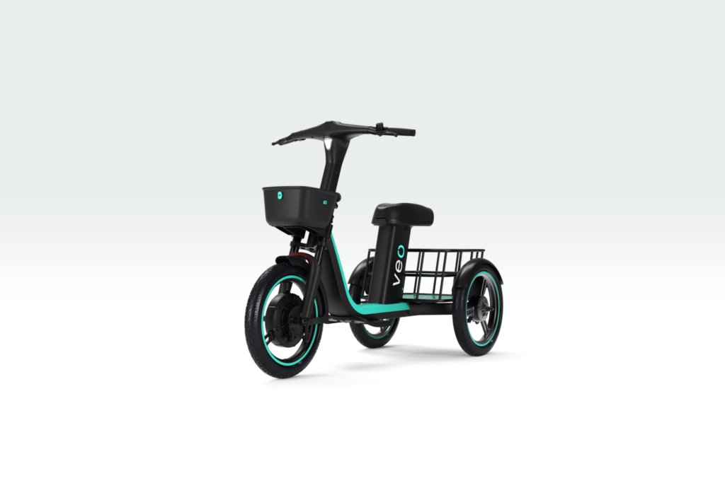 Black electric cargo trike with turquoise accents, front basket, single seat and rear cargo rack on a white background