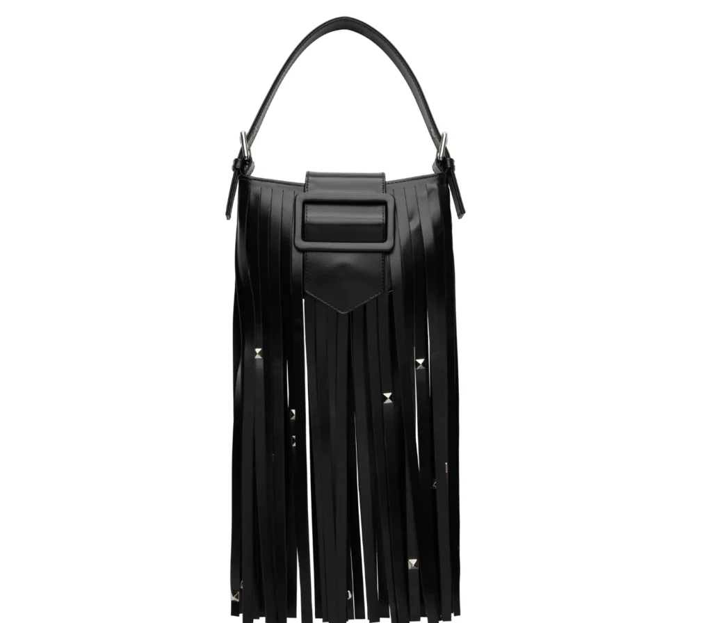 Black leather shoulder bag with long vertical fringe, silver studs, and a rectangular front flap against a white background