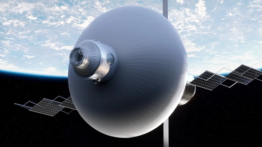 Large spherical spacecraft with a metallic front port and multiple solar-panel wings orbiting above Earth against a starry