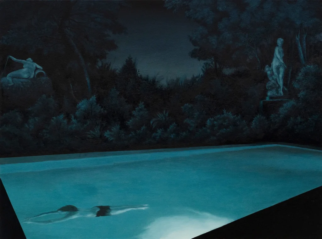 A turquoise-lit swimming pool at night, with two swimmers underwater and classical statues amid dense garden foliage