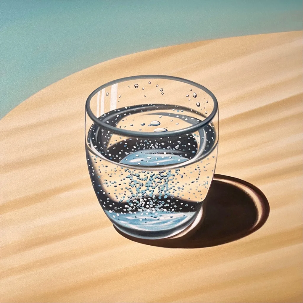 A show for clear glass tumbler filled with water and bubbles, casting a dark oval sil on a warm wooden surface