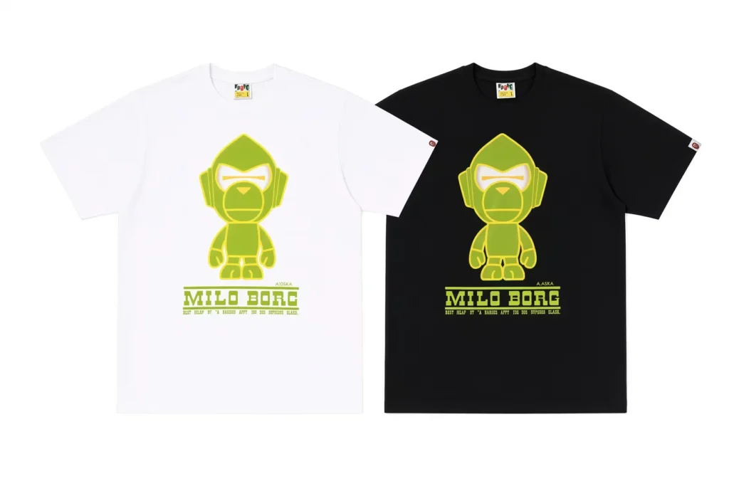 White and black T-shirts displayed side by side, each featuring a lime-green cartoon robot and Milo Borg text on a white