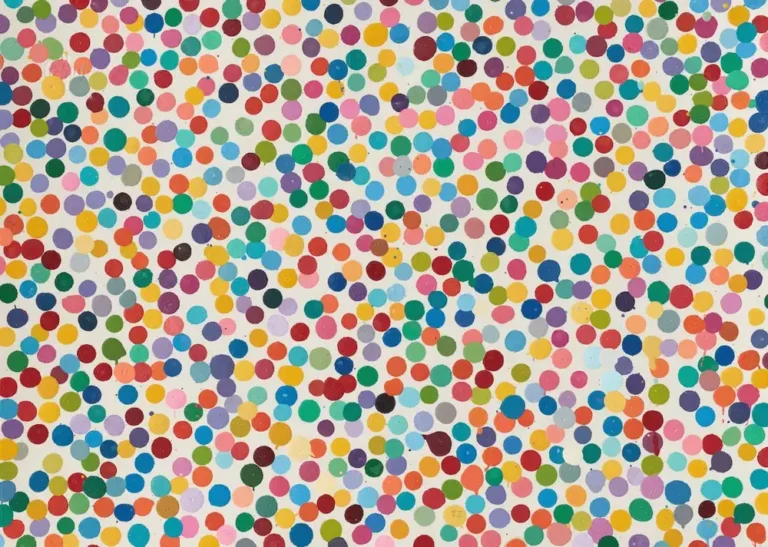 White background covered with hundreds of multicolored circular dots in varied sizes and scatter arrangement