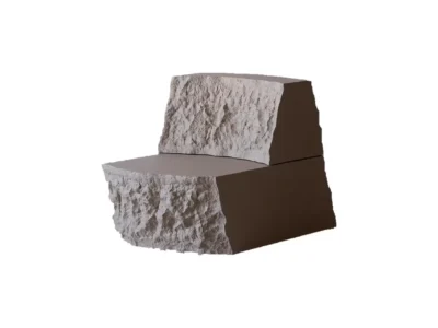 Sculpture gray lounge chair with rough stone-like front and back surfaces, smooth dark brown sides, on white background