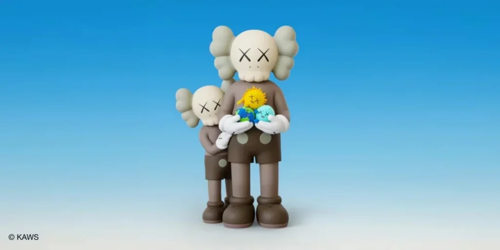 Two gray figurines with X-shaped eyes stand against a blue sky, holding three small colorful figures:VEVENT