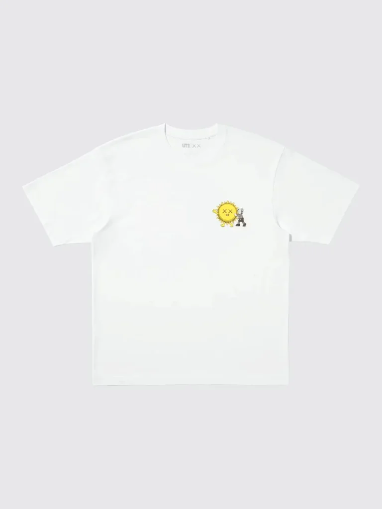 White Tee feature a small yellow sun character and gray figure graphic on the chest, laid flat on a pale background