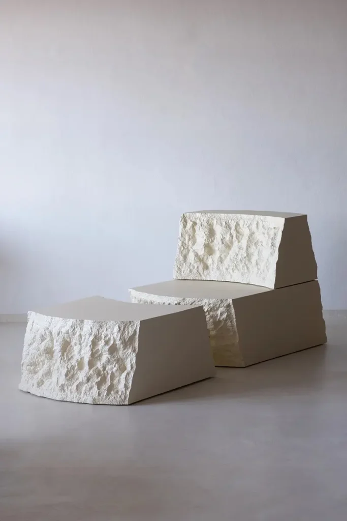 Lapis Lounge Chair with matching torn-foam ottoman in a pale stone-like finish.