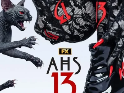 Gray snarling cat-like creature faces a black lace-clad figure with red claw accents beside the AHS 13 logo