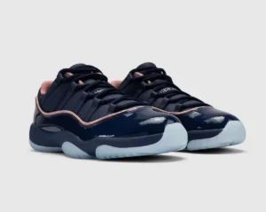 Pair of glossy navy sneakers with rose-gold trim, black laces and pale blue translucent soles on a light background