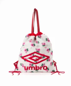 White sherpa Umbro drawstring backpack with pink floral print, red straps, logo and zipper, on white background