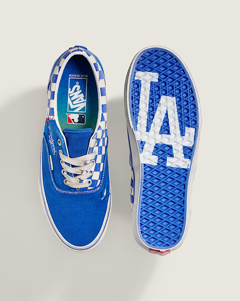 Blue Vans sneakers with checkerboard accents, one shown from above and one showing a Dodgers logo sole