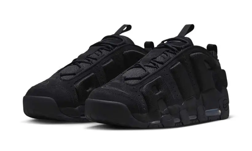 Pair of black trail sneakers with rugged segmented soles and pull tabs, arranged against a white background