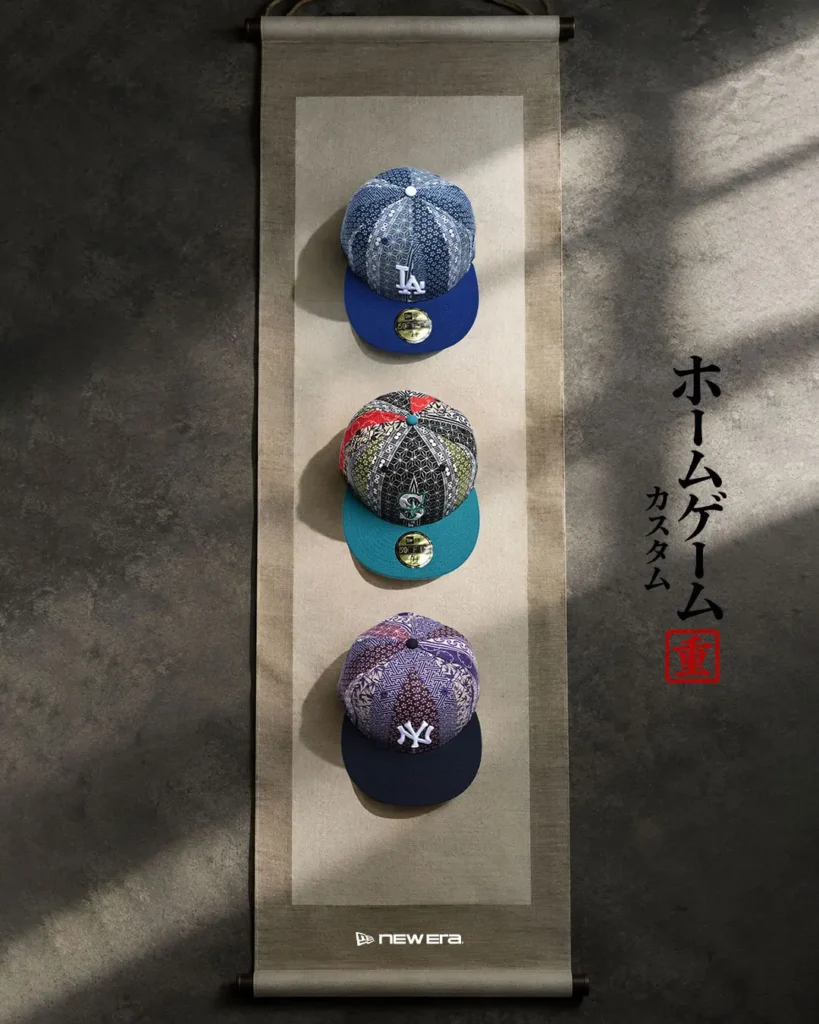 Three pattern baseball caps with blue, teal and black brims displayed vertically on a hanging scroll-style panel beside