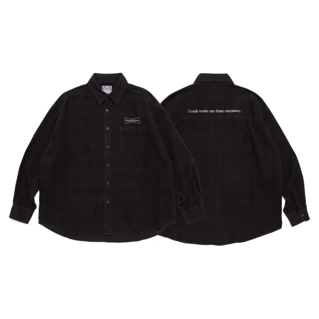 Front and back views of a black button-up shirt with a chest pocket and white text across the upper back
