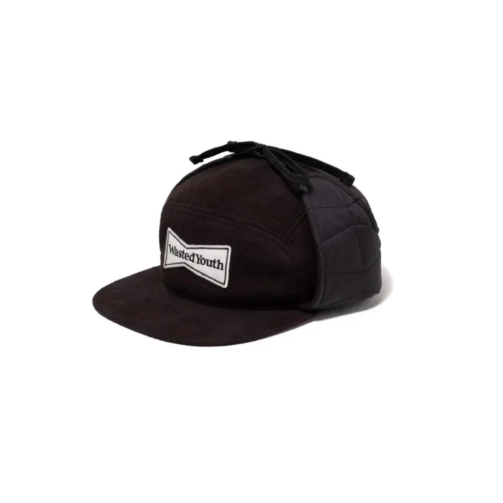 Black quilted cap with a flat brim, drawstring top, and Wasted Youth patch on the front