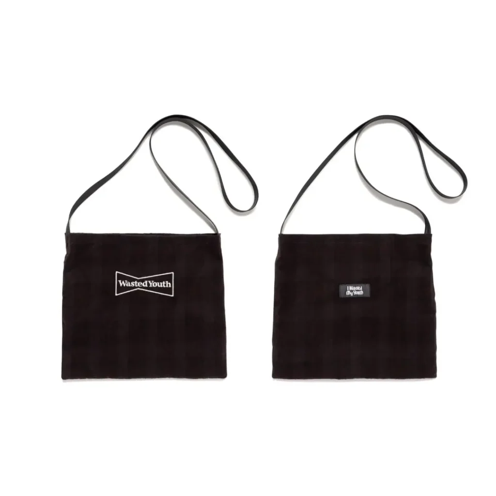 Two black rectangular shoulder bags with long straps and small white logo patches on a white background