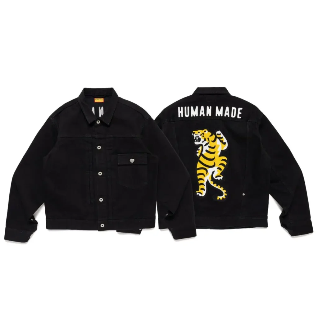 Black Human Made denim jacket shown front and back, featuring a yellow-and-white tiger graphic on the back