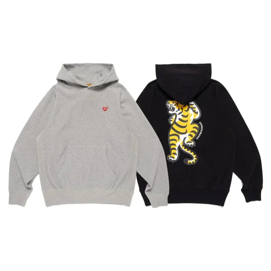 Gray and black hooded sweatshirts, with a small red heart on the gray and a tiger graphic on the black