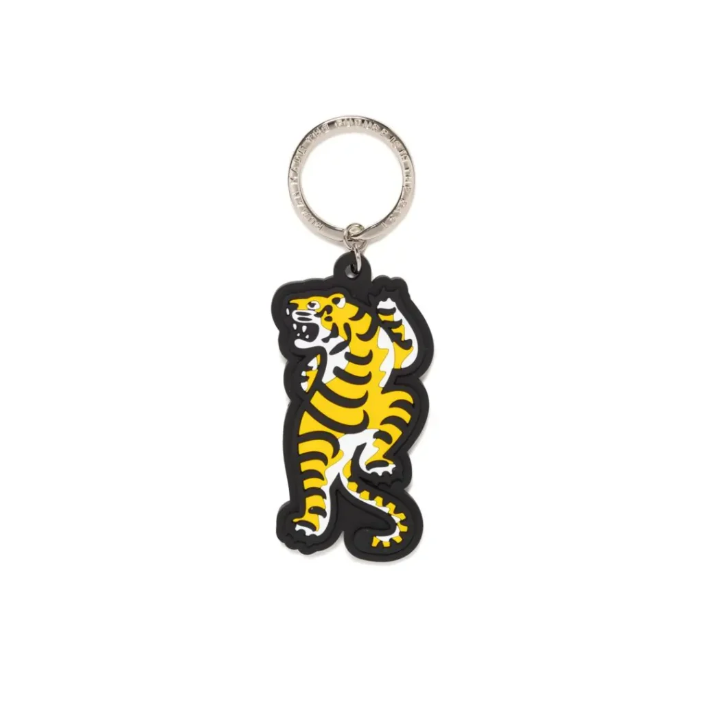 Yellow-and-black tiger-shaped keychain with a silver ring on a white background