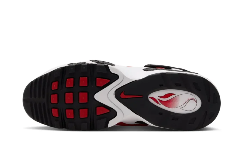 Underside of a black, white, and red athletic shoe with patterned tread and a curved logo panel