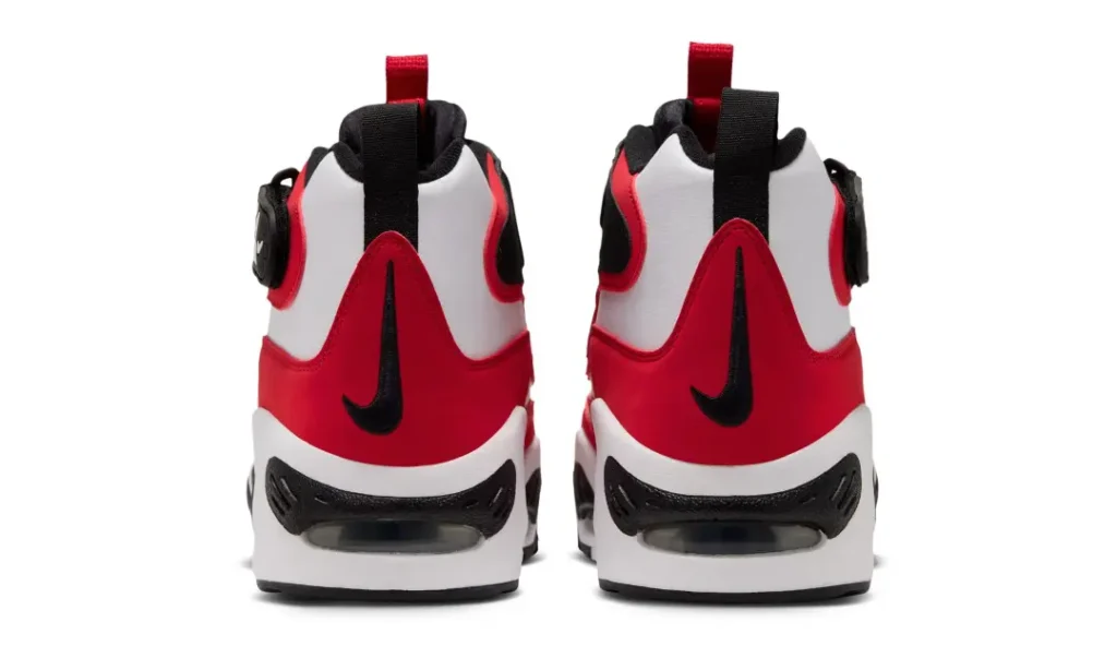 Rear view of matching red, white and black Nike high-top sneakers with visible heel air cushions against a white background