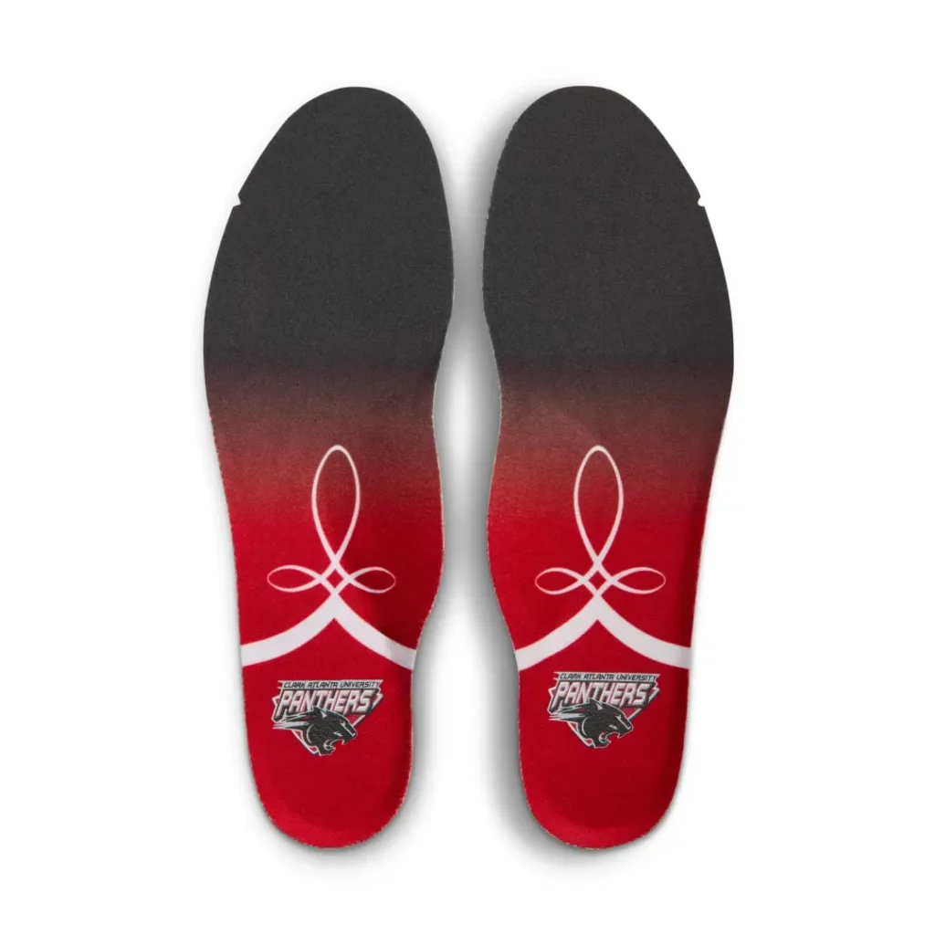 Pair of black and red insoles with white loops and Panthers logos near the heels