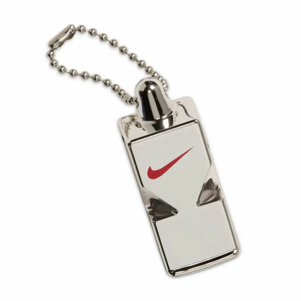 Silver Nike swoosh keychain with a ball chain on a white background