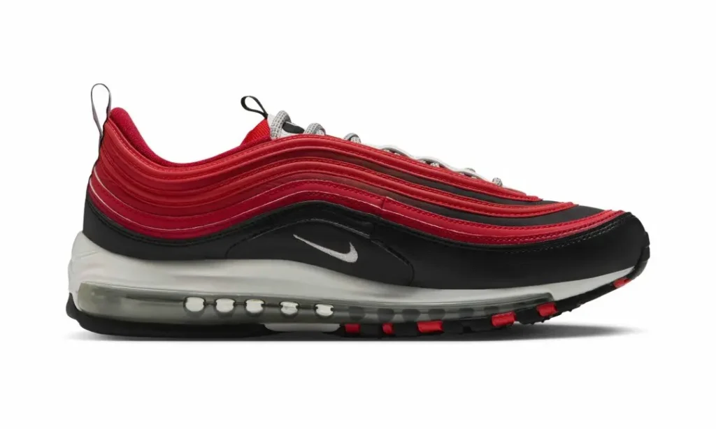 Side view of a black, red, and white Nike sneaker with visible air cushioning against a white background