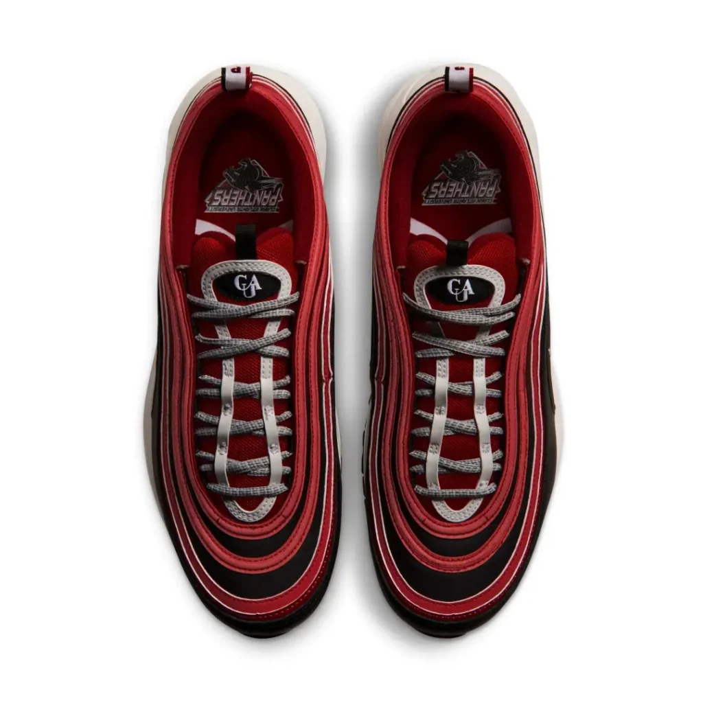 Pair of black, red, and white sneakers viewed from above, with laces and patterned interiors visible