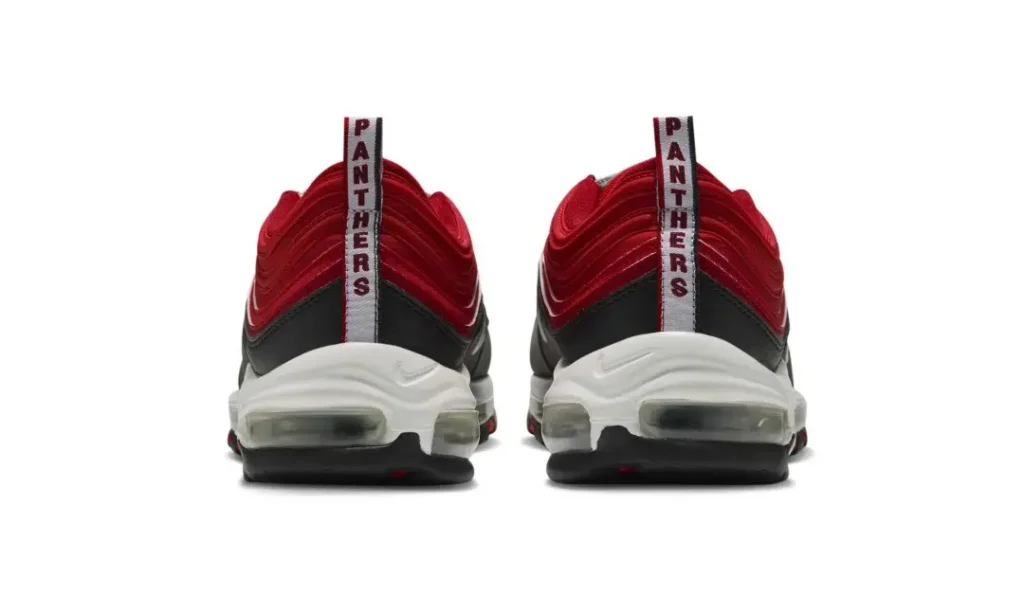 Rear view of two red, black, and white sneakers with “PANTHERS” printed on their heel straps