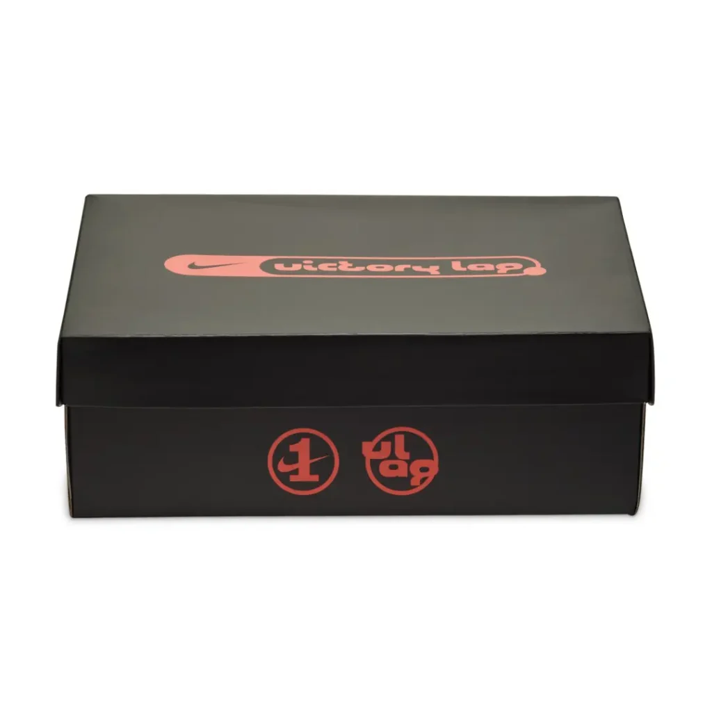 Black Nike shoebox with pink Victory Lap branding and Air Force 1 logos on the front, isolated on white background