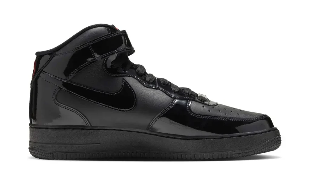 Black patent leather Nike Air Force 1 Mid sneaker shown in side profile against a white background