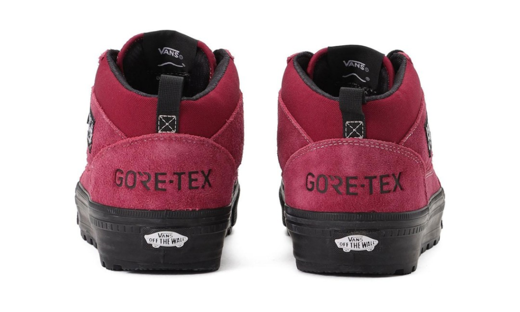 Rear view of burgundy Vans high-top sneakers with suede panels, black soles, and GORE-TEX branding on a white background