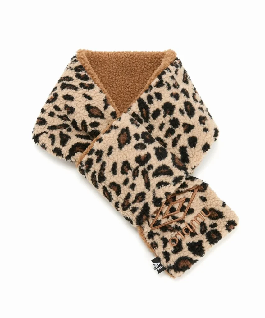 Leopard-print fleece scarf with a brown sherpa collar and embroidered Umbro logo, isolated on white background