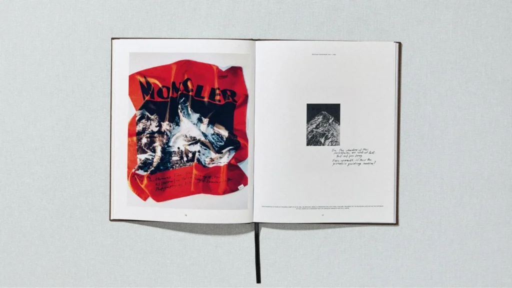 Open book showing a red Moncler mountain graphic on the left and a black-and-white mountain photo with handwritten text on