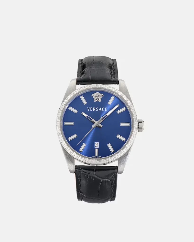 Versace watch with a blue dial, silver case and Greek-key bezel, Medusa emblem, date window, and black leather strap on