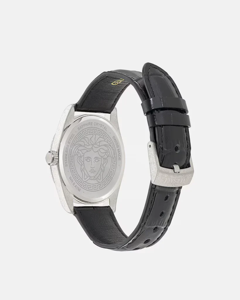 Versace watch with silver-toned case, black leather strap, and Medusa engraving on the caseback against a white background