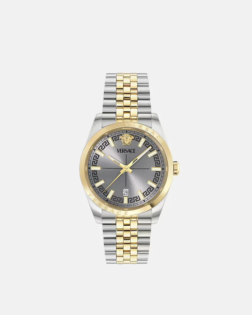 Versace two-tone silver and gold watch with gray dial, Greek key border, Medusa emblem, and date window on white background