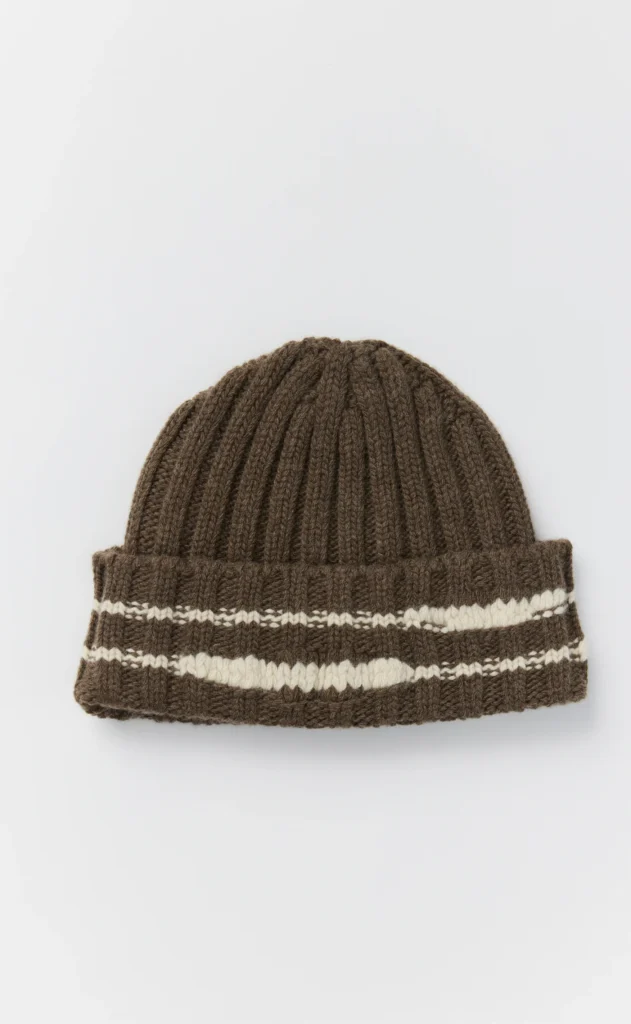 Brown ribbed knit beanie with two cream patterned stripes, centered against a white background