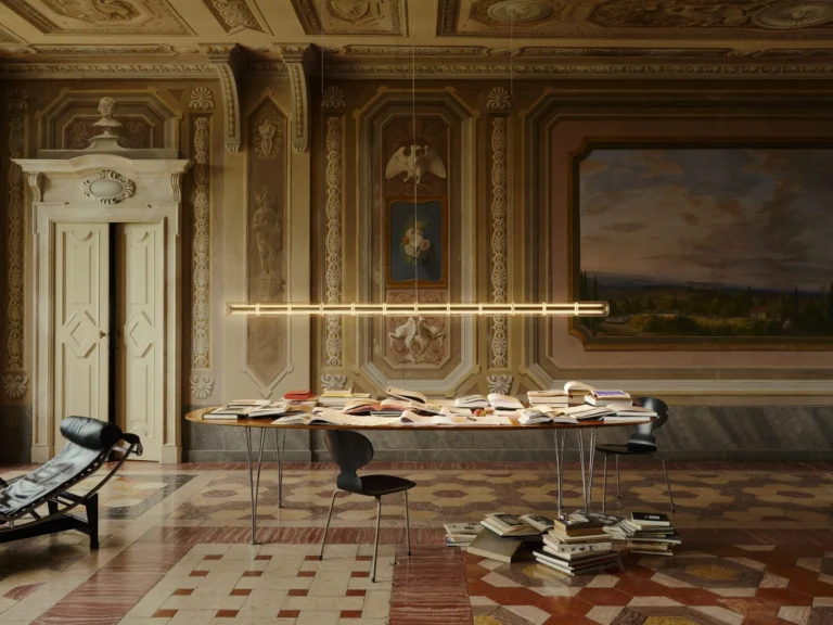 Linear pendant light with glowing spheres hangs above a book-covered table in an ornate historic room