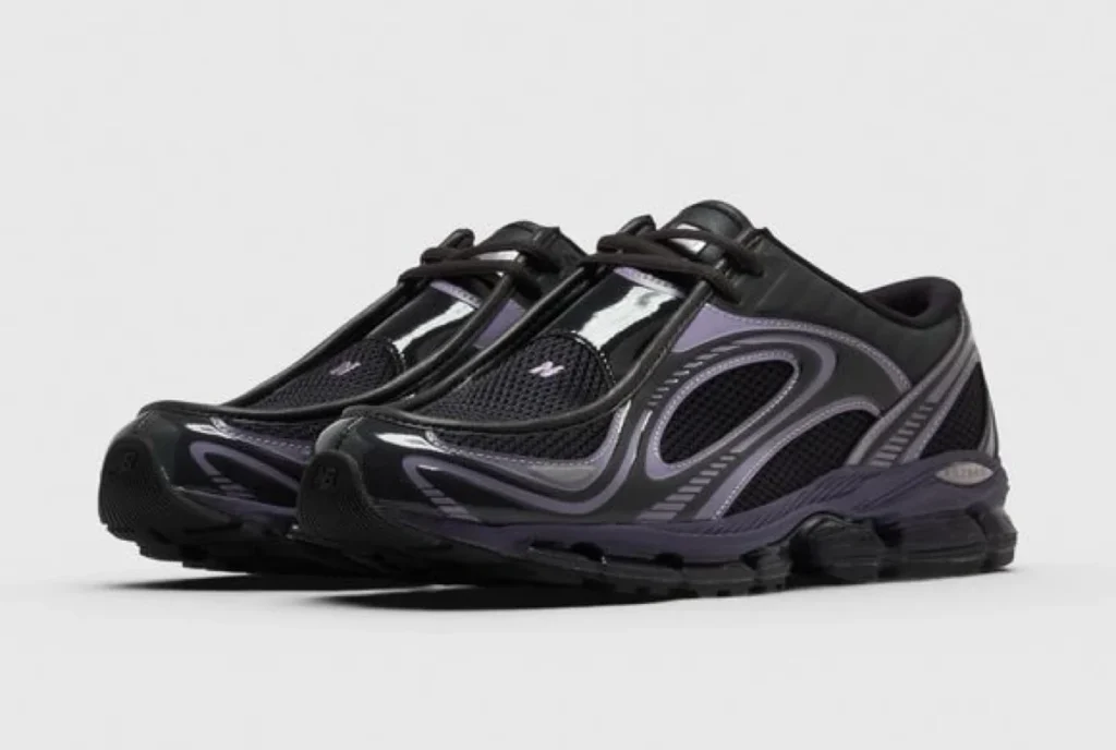 Pair of black and purple low-top sneakers with mesh panels and chunky soles on a white background