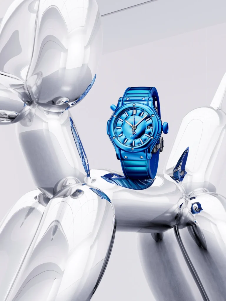 Blue wristwatch displayed between glossy white humanoid robots